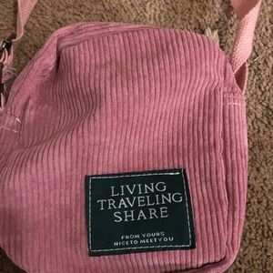 pink living traveling share crossbody purse